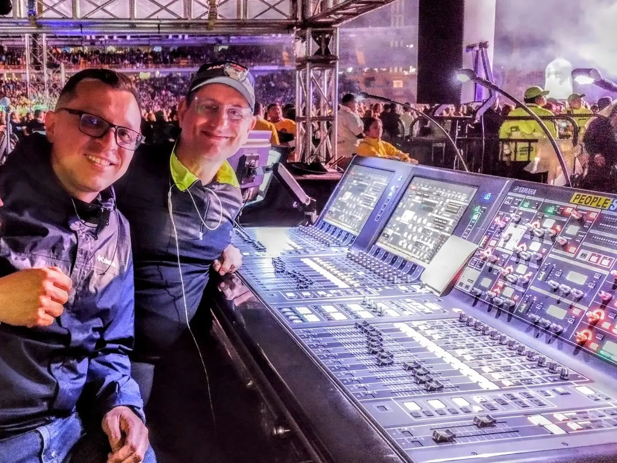 Néstor Randazzo with a Yamaha representative at the front-of-house console during a festival in Bogotá, Colombia